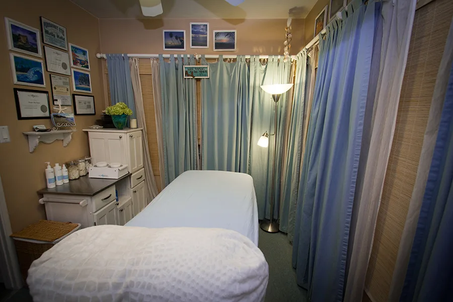 Treatment room with sugaring table and beach curtains